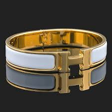 H- WHITE HANDCUFF