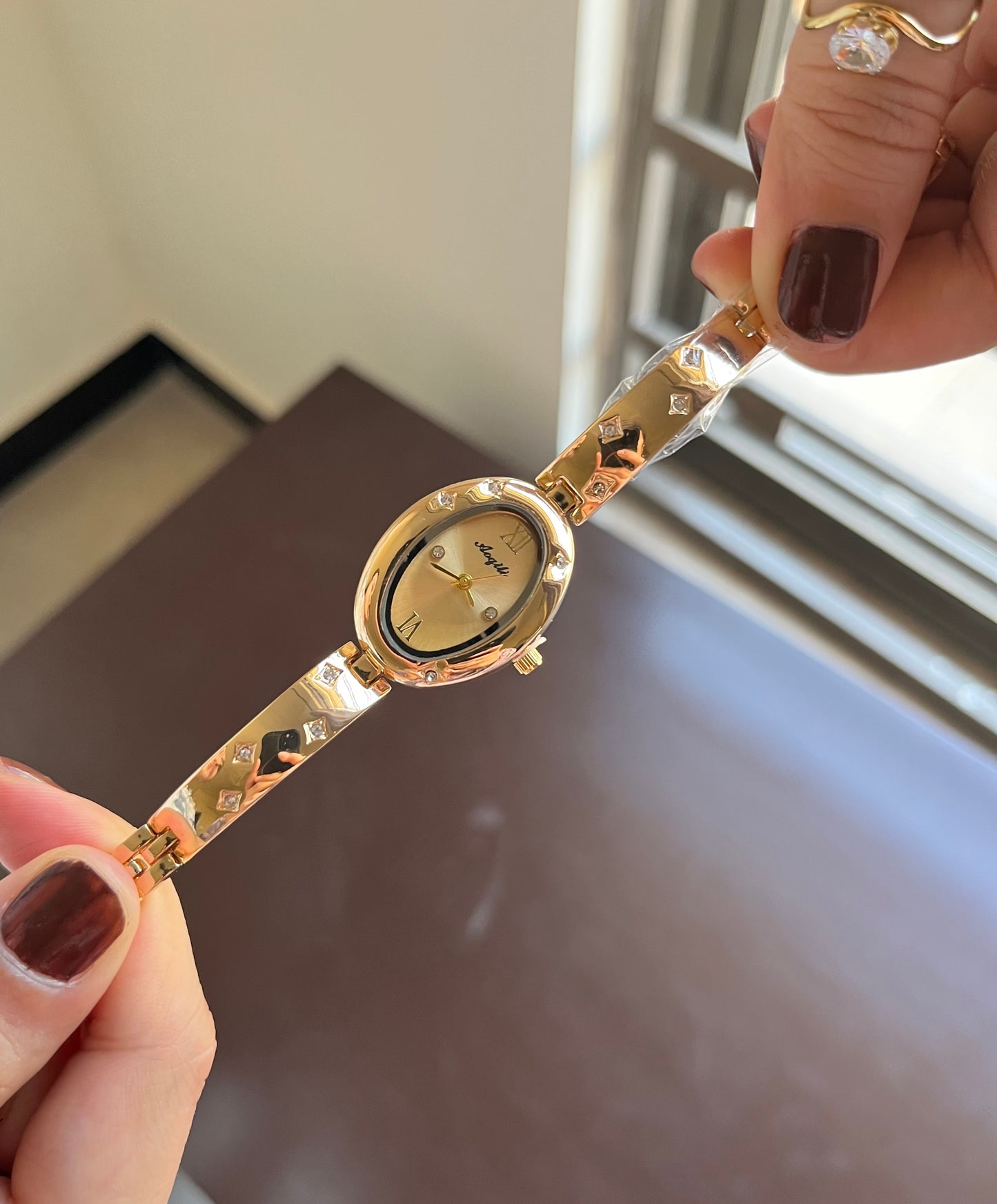 Oval Gleem golden Dial Watch